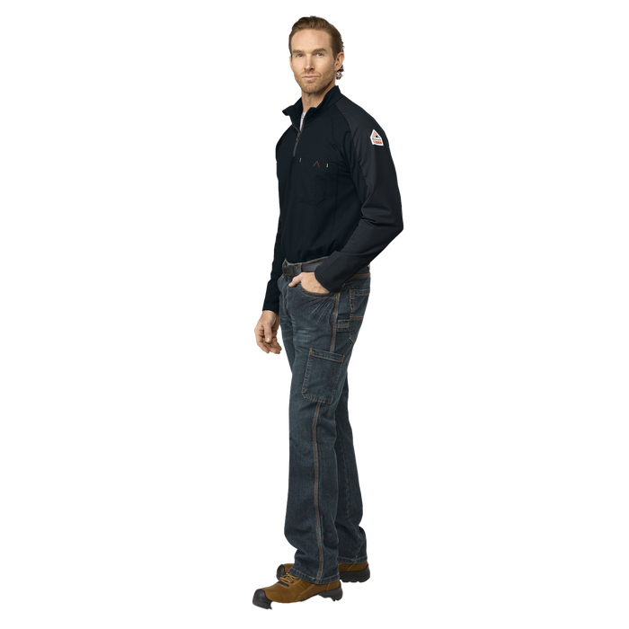 Man wearing a black shirt and dark jeans on a white background