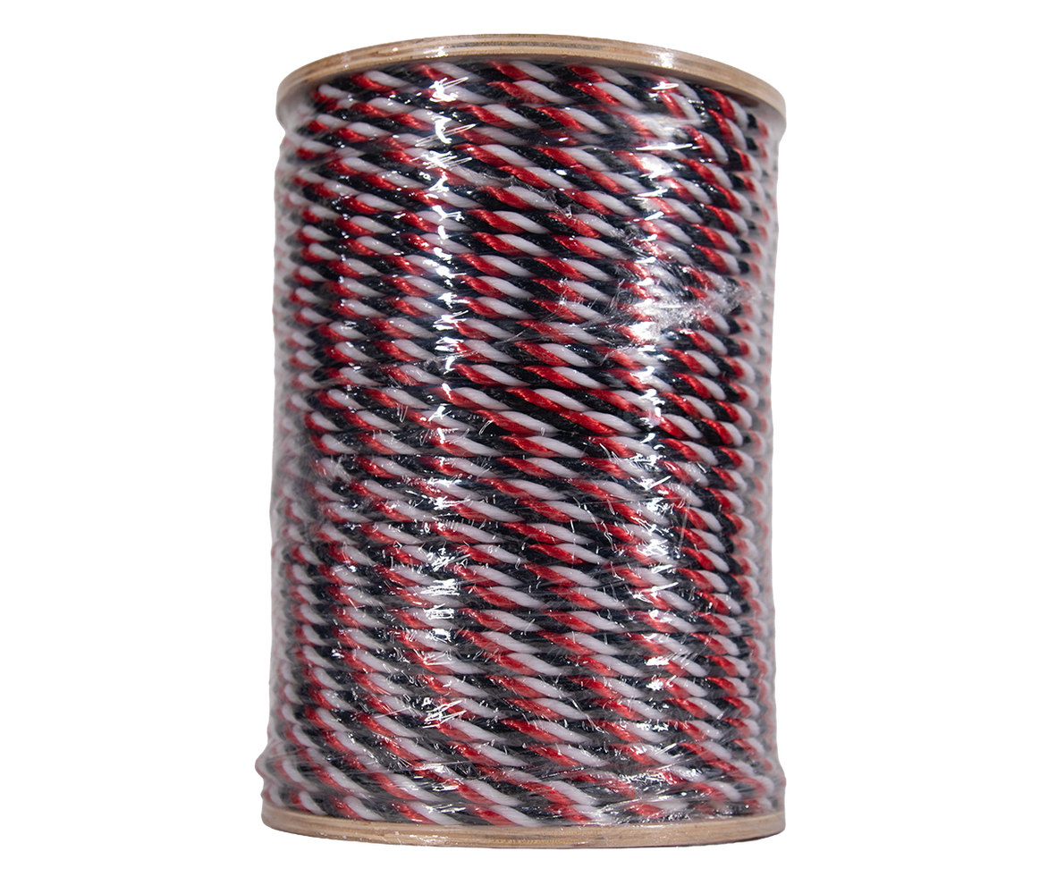 Spool of black, red, and white rope on a white background